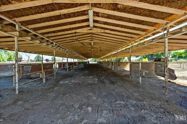 a view of a garage with wooden deck