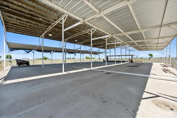 a view of yard with patio