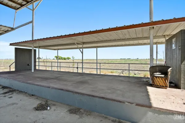a view of a house with outdoor seating space