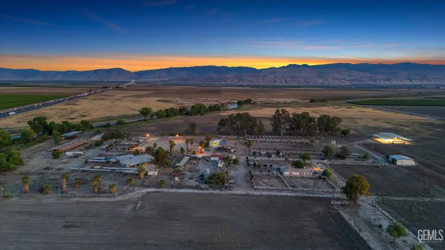 a view of a street with a yard