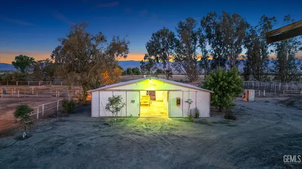 a view of a parking space with a garage