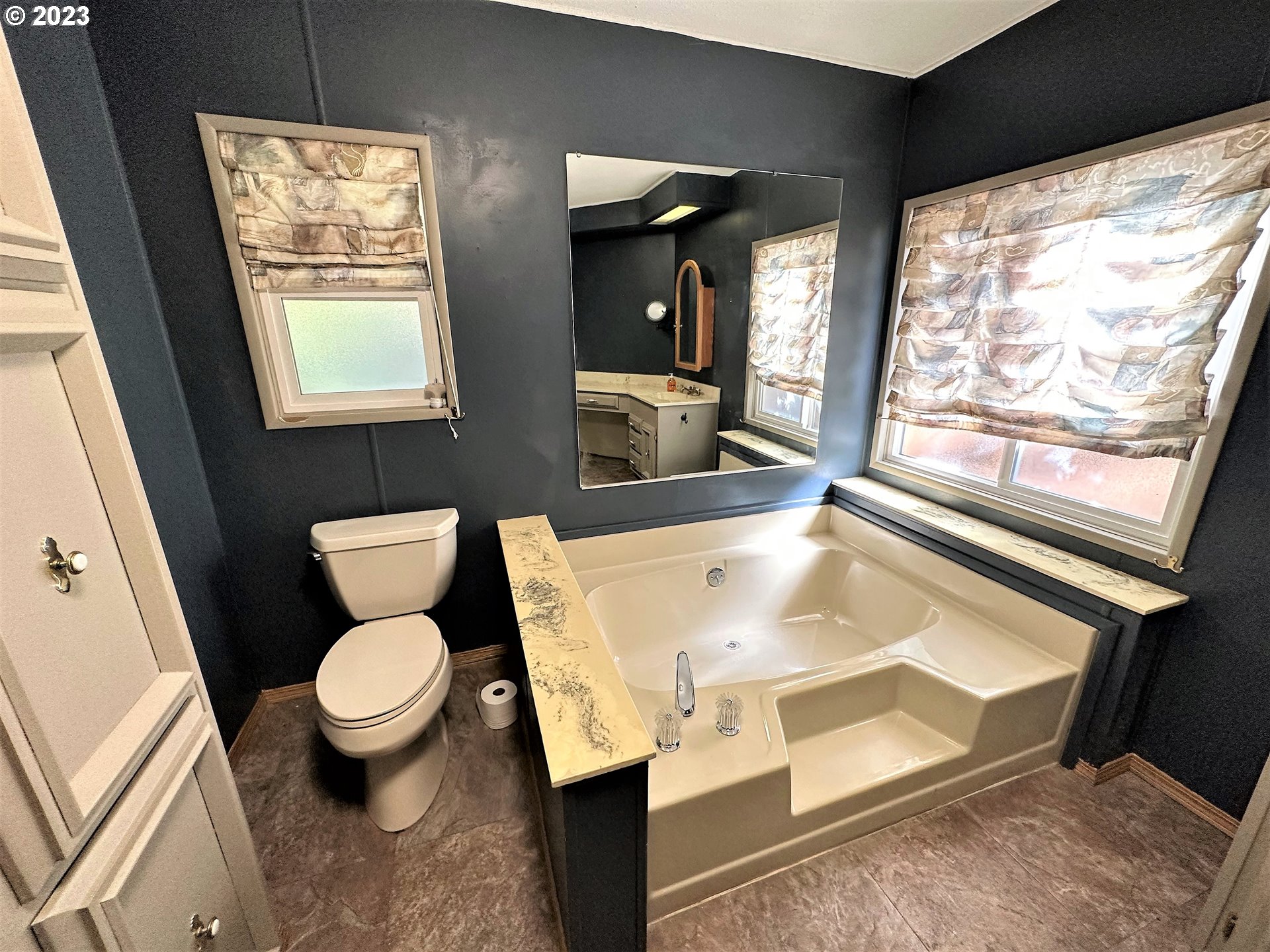 3153 Strickland Canyon Road Roseburg, OR 97471 - Photo 11 of 31 a bathroom with a toilet sink and mirror