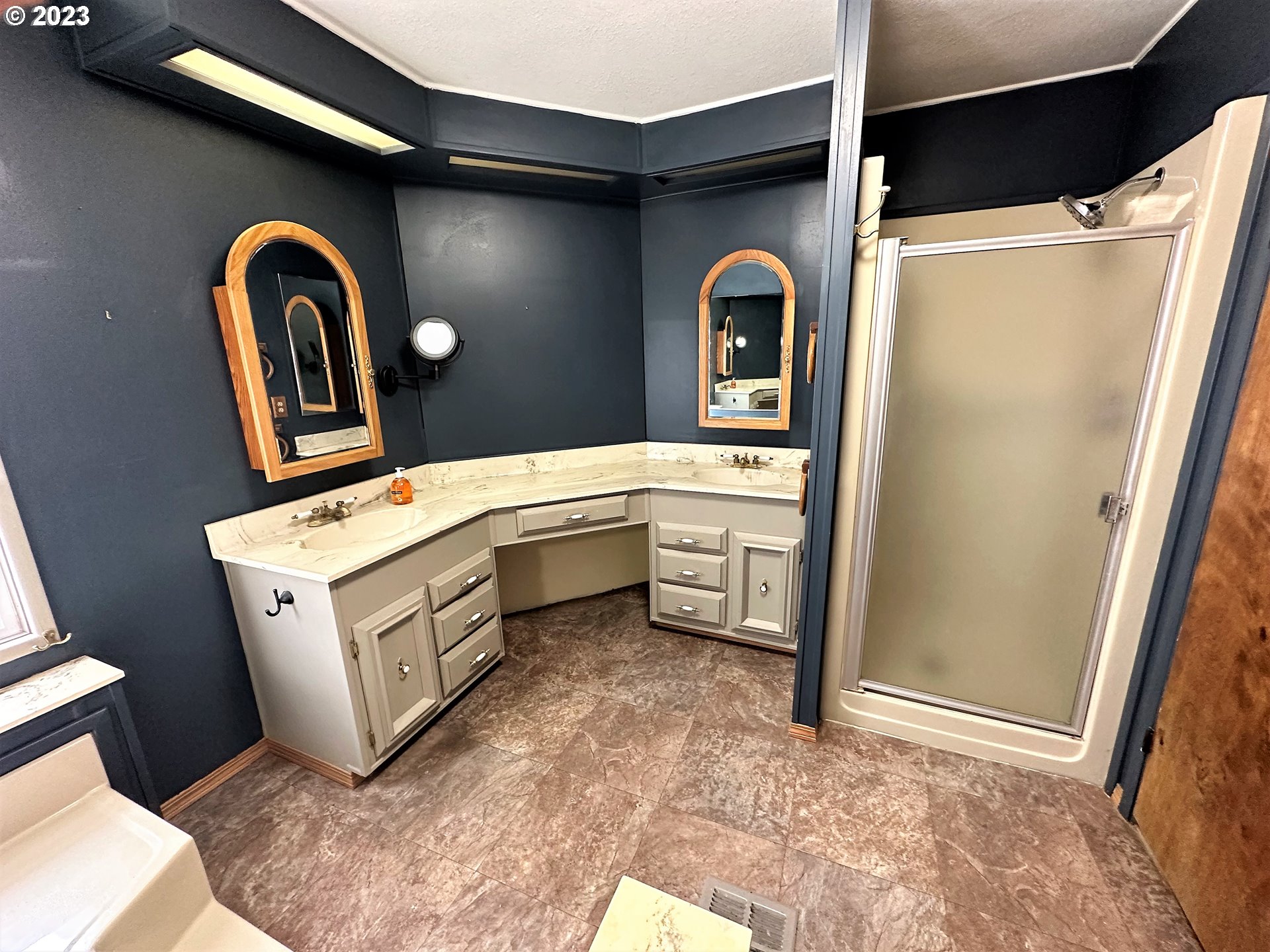 3153 Strickland Canyon Road Roseburg, OR 97471 - Photo 12 of 31 a bathroom with a sink a mirror and shower