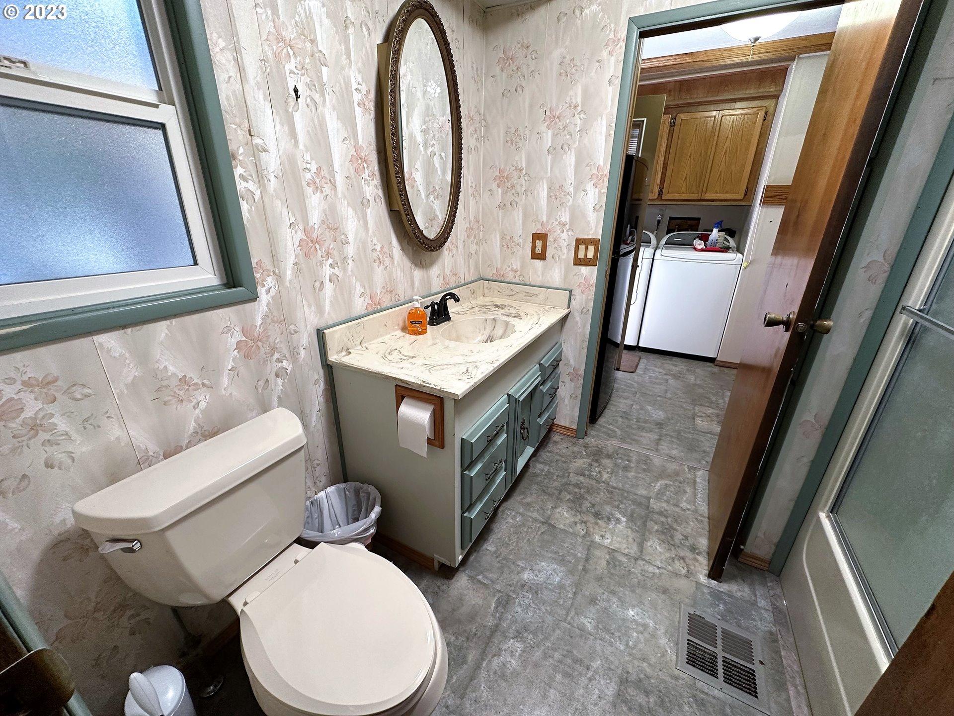 3153 Strickland Canyon Road Roseburg, OR 97471 - Photo 14 of 31 a bathroom with a toilet sink and mirror