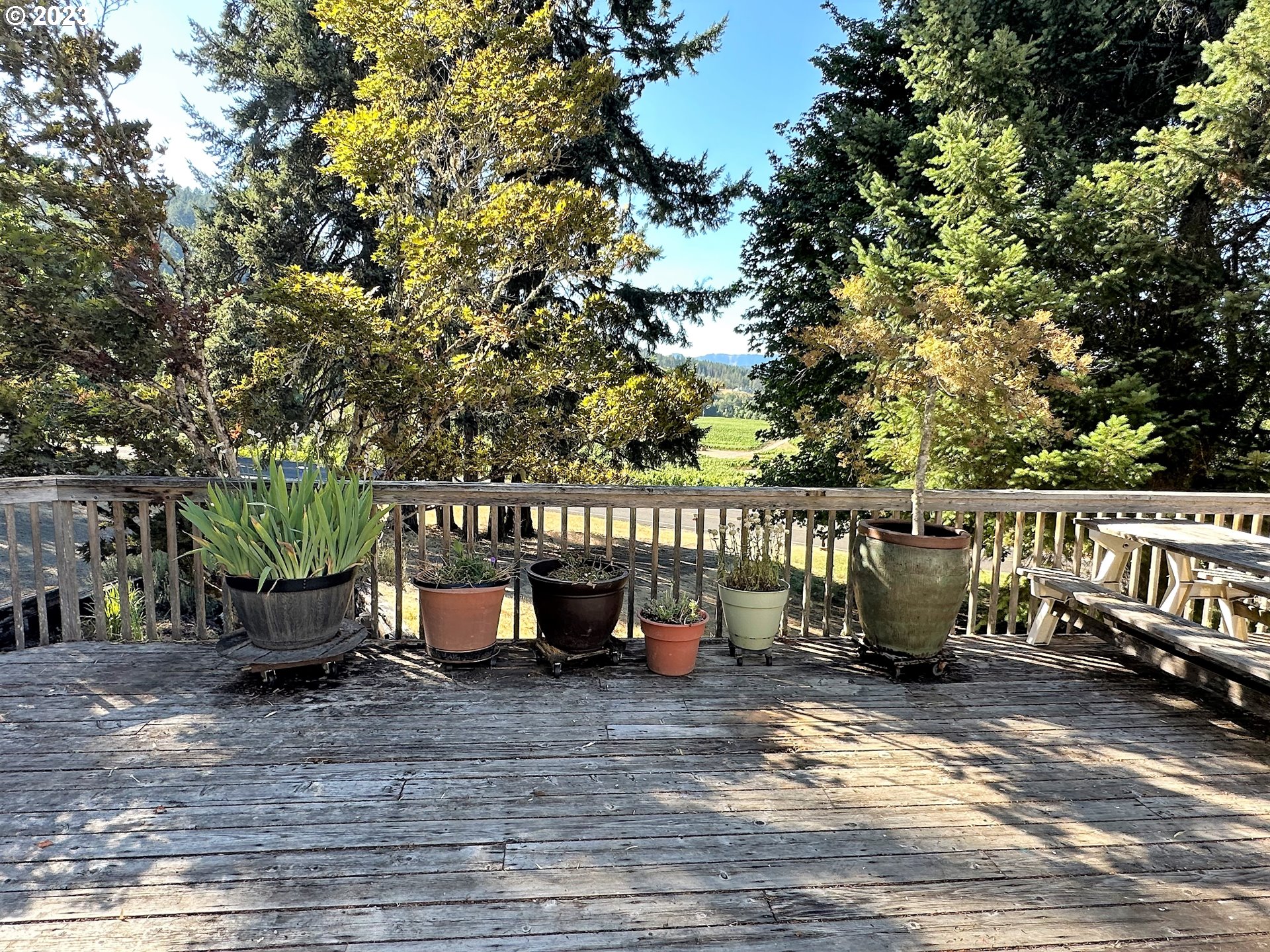 3153 Strickland Canyon Road Roseburg, OR 97471 - Photo 21 of 31 a view of a wooden deck with chairs and a backyard