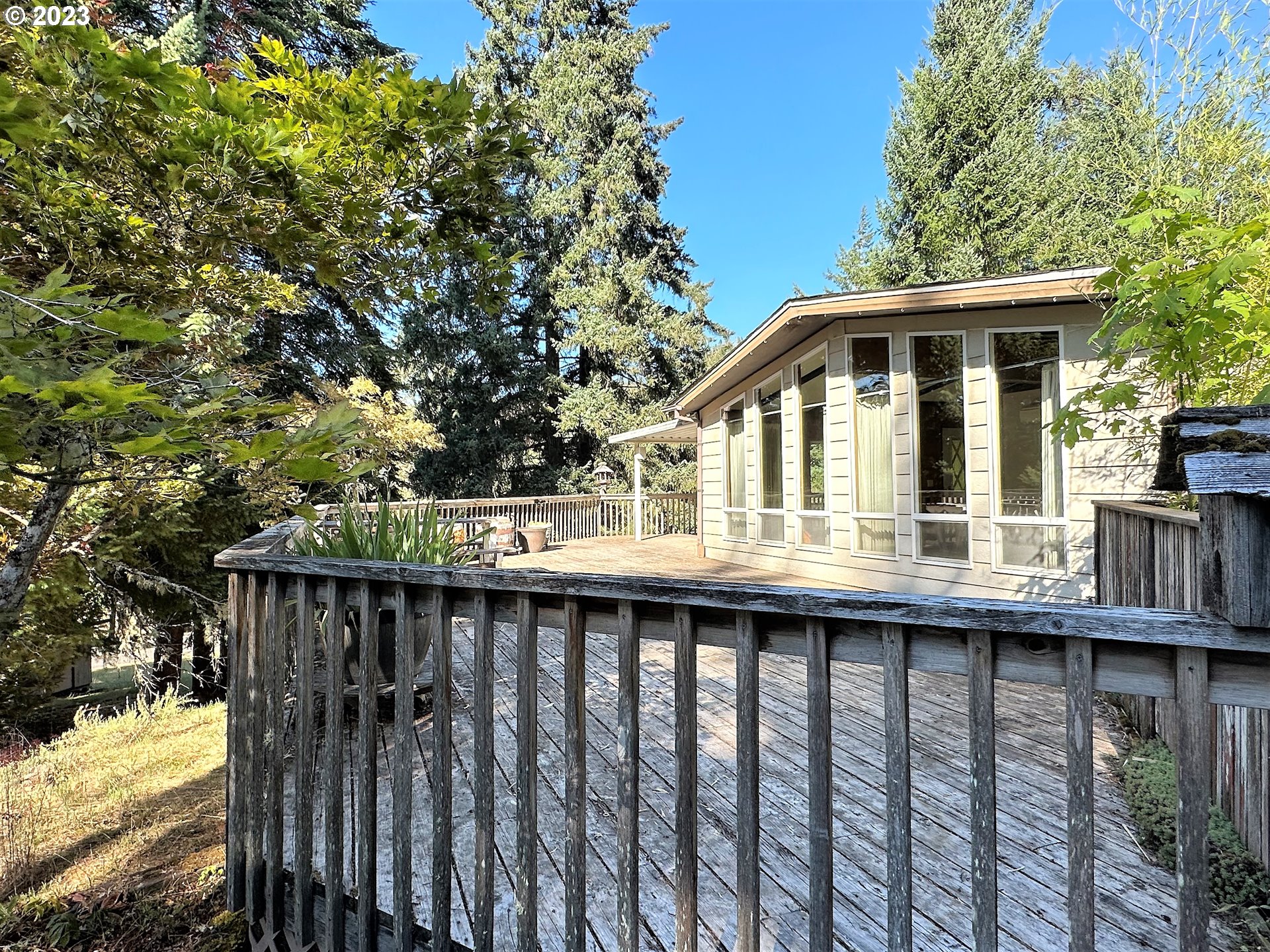 3153 Strickland Canyon Road Roseburg, OR 97471 - Photo 22 of 31 a front view of a house with a wooden deck
