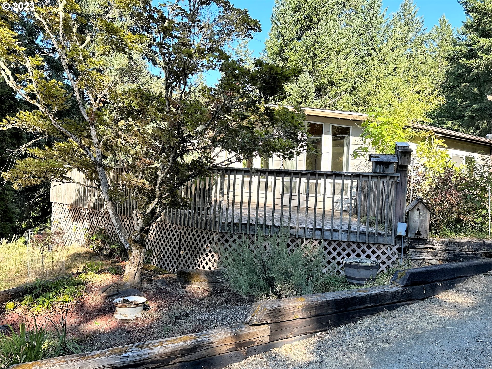 3153 Strickland Canyon Road Roseburg, OR 97471 - Photo 23 of 31 a view of a house with a yard