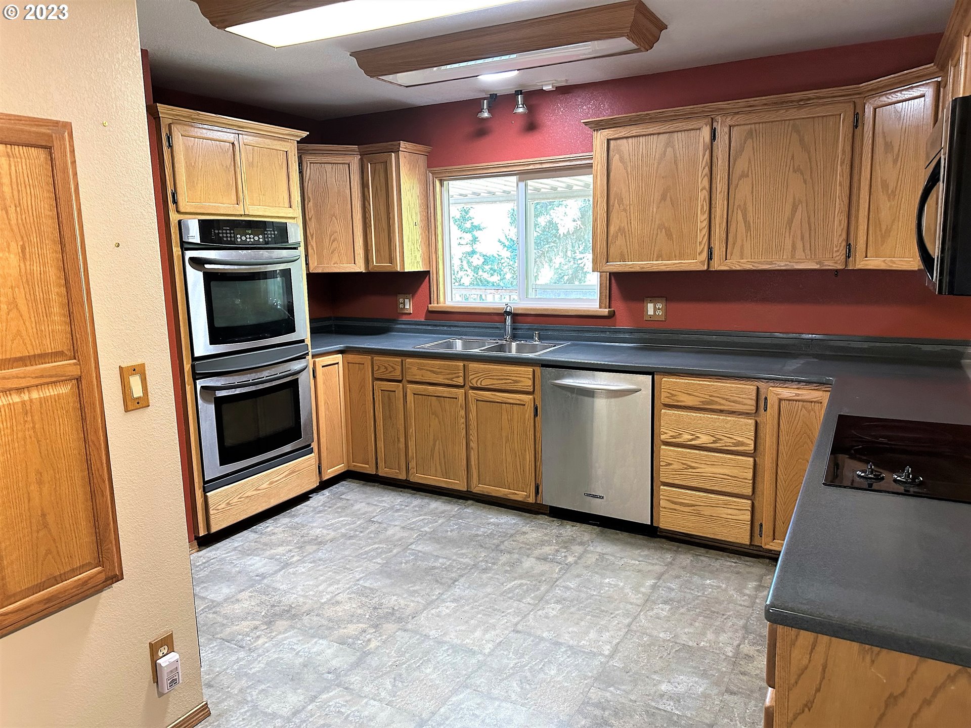 3153 Strickland Canyon Road Roseburg, OR 97471 - Photo 5 of 31 a kitchen with stainless steel appliances granite countertop a stove and a sink