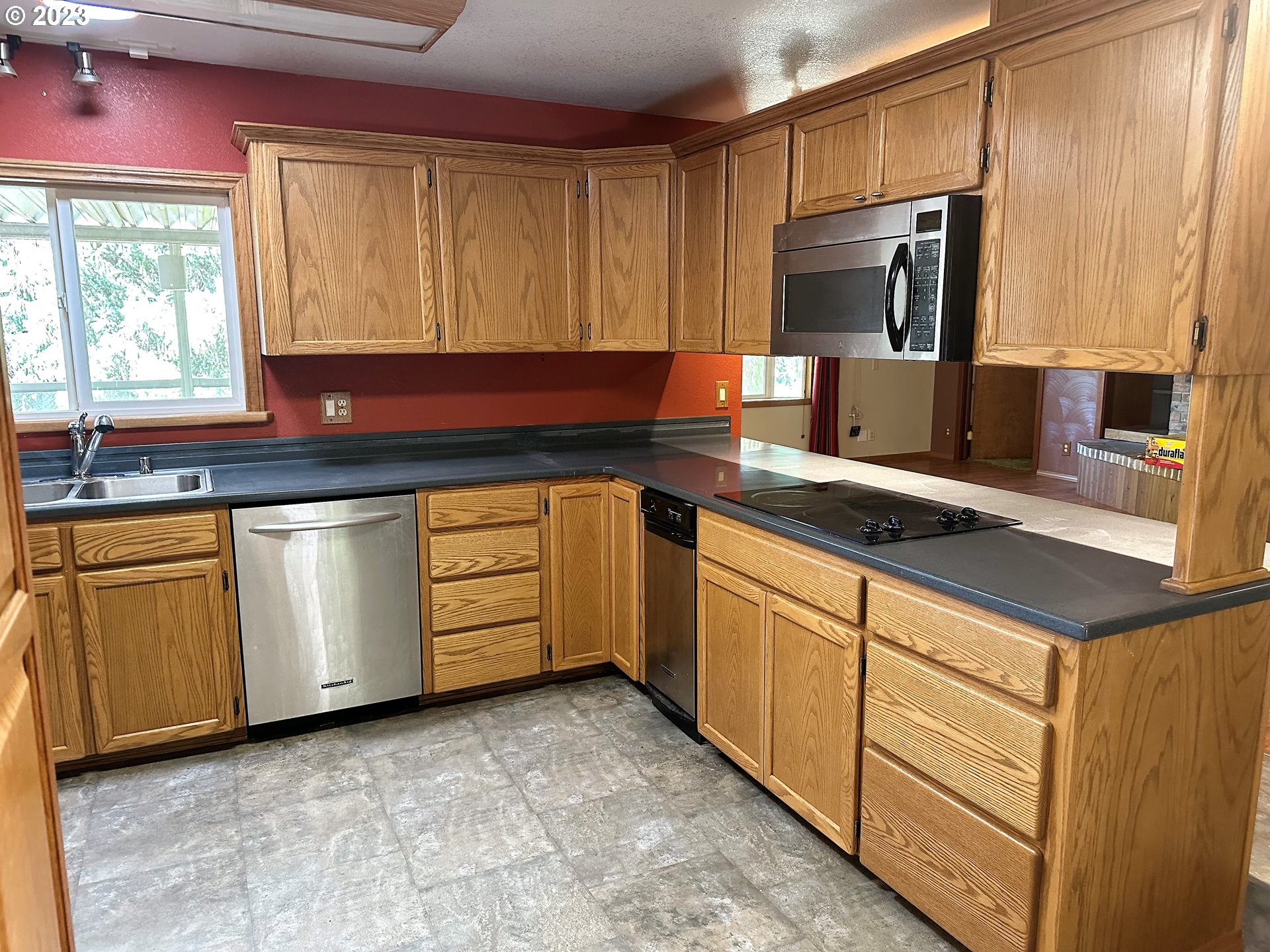3153 Strickland Canyon Road Roseburg, OR 97471 - Photo 6 of 31 a kitchen with stainless steel appliances granite countertop a sink and a stove