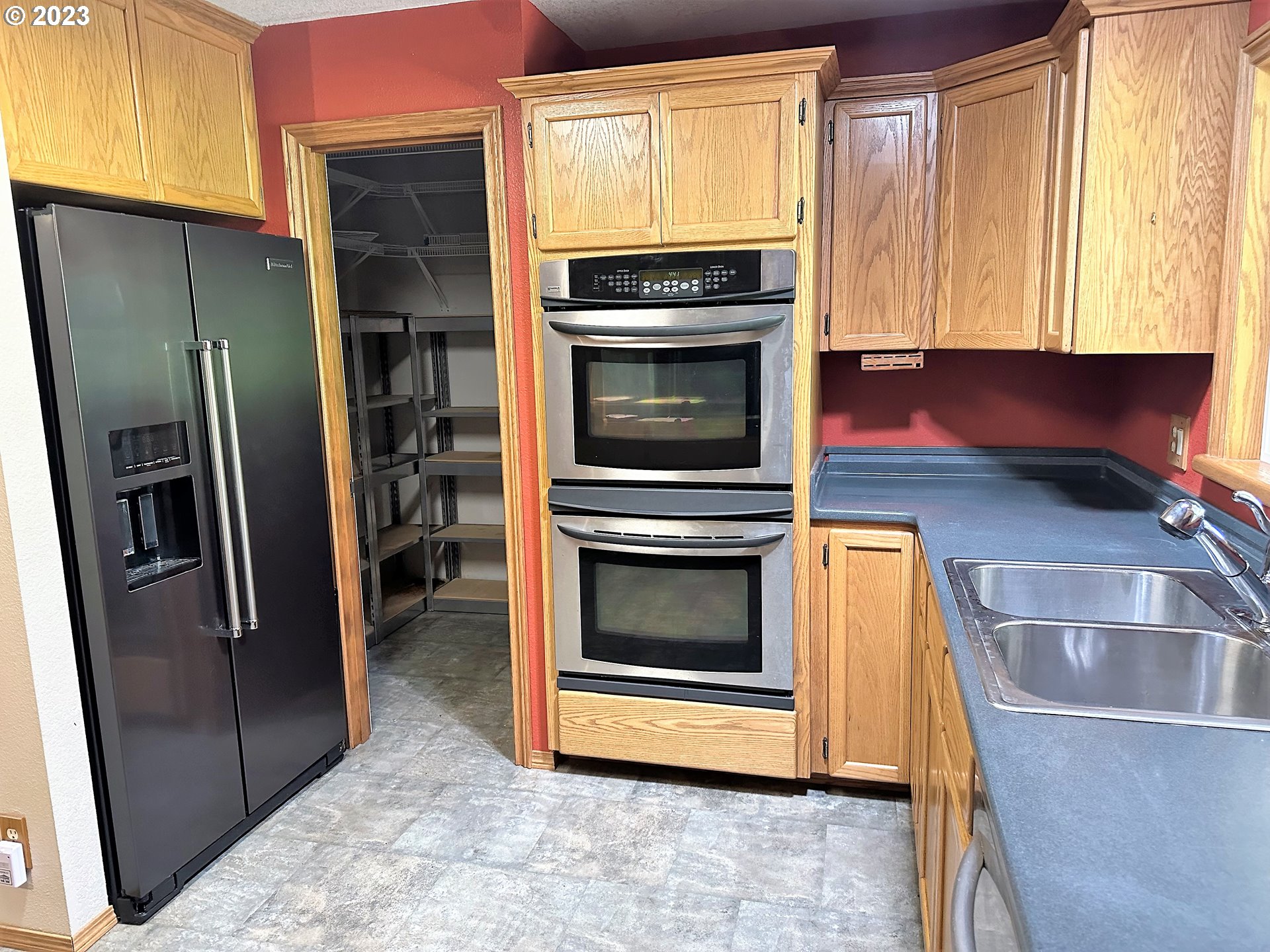 3153 Strickland Canyon Road Roseburg, OR 97471 - Photo 7 of 31 a kitchen with granite countertop a refrigerator and a sink