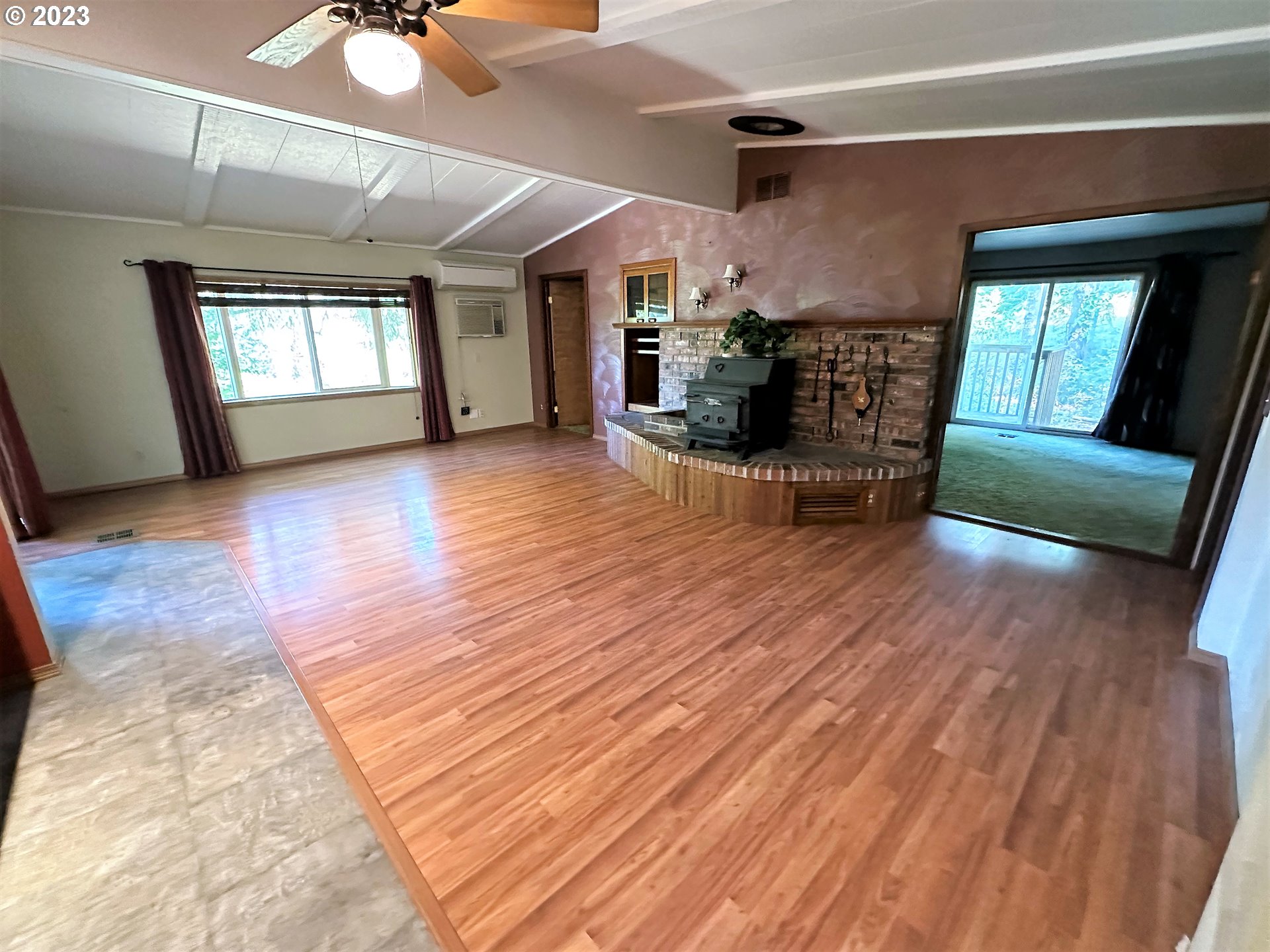 3153 Strickland Canyon Road Roseburg, OR 97471 - Photo 8 of 31 a view of livingroom with hardwood floor and a ceiling fan