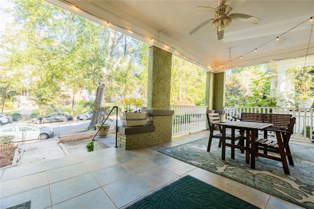 887 Myrtle Street Northeast Atlanta, GA 30309 - Photo 21 of 27 a dining room with furniture a chandelier and wooden floor