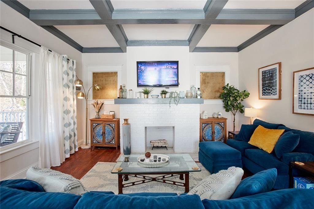 887 Myrtle Street Northeast Atlanta, GA 30309 - Photo 3 of 27 a living room with furniture and a fireplace