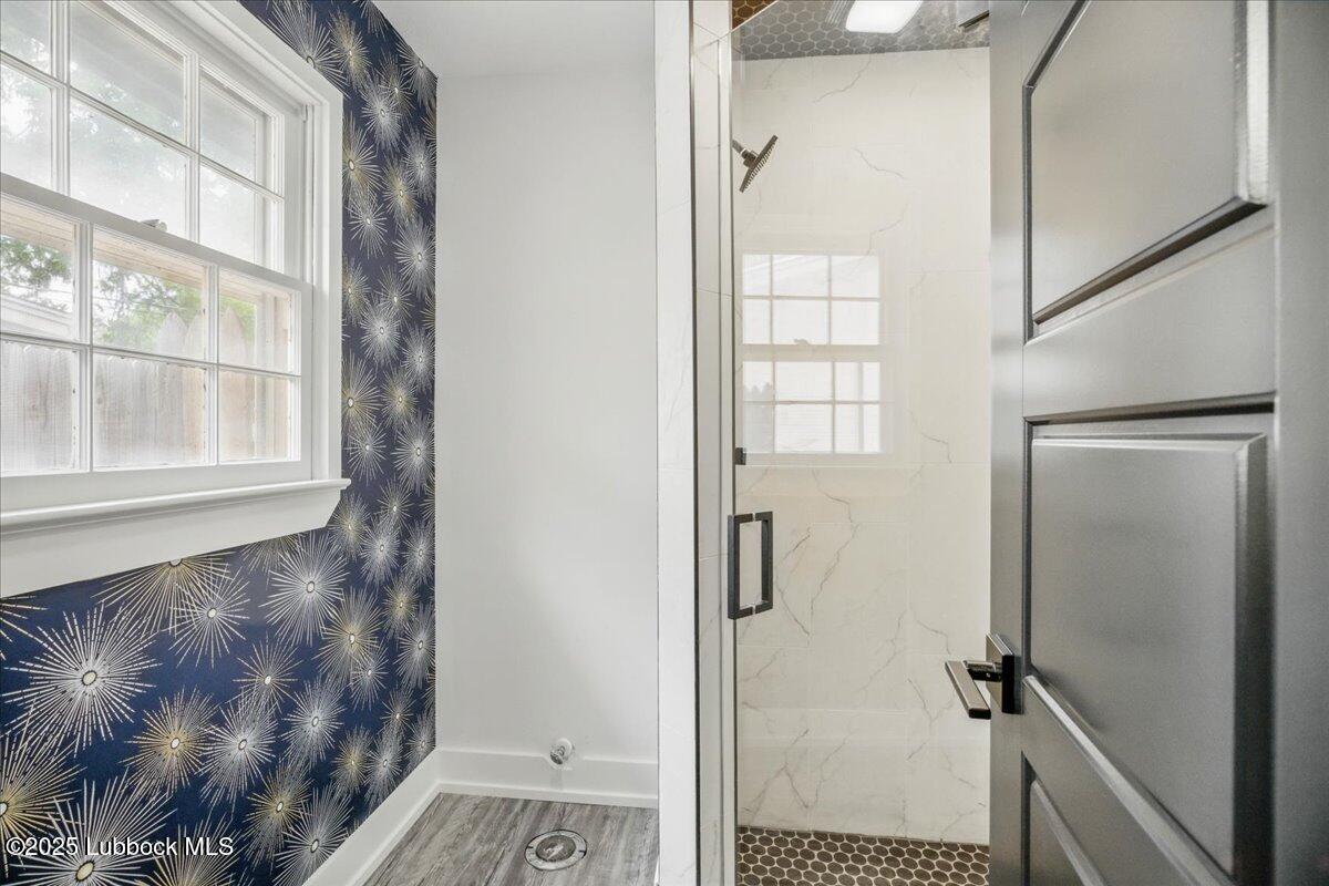 4214 64th Street Lubbock, TX 79413 - Photo 19 of 32 a bathroom with a shower