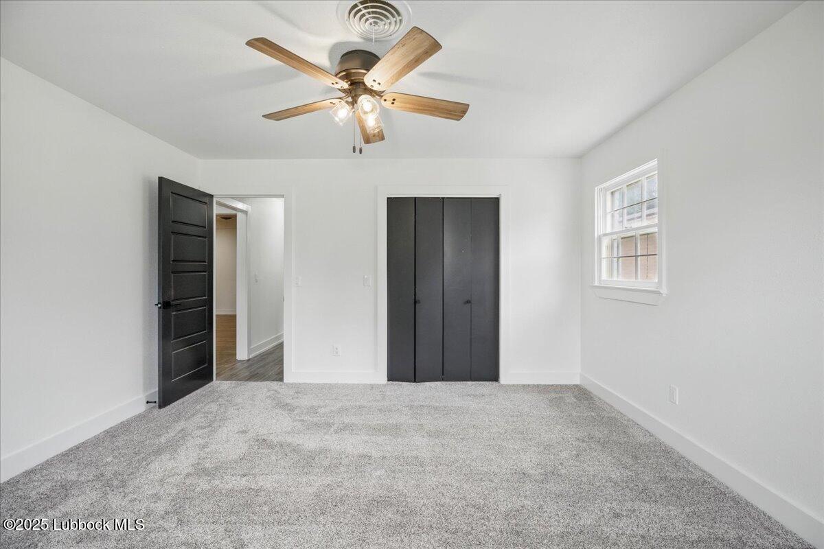 4214 64th Street Lubbock, TX 79413 - Photo 25 of 32 a view of a livingroom with a ceiling fan