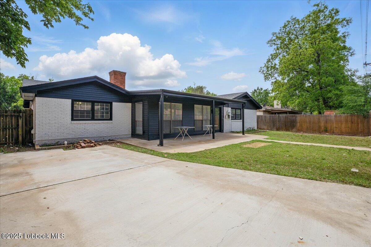4214 64th Street Lubbock, TX 79413 - Photo 32 of 32 a front view of a house with a yard and garage