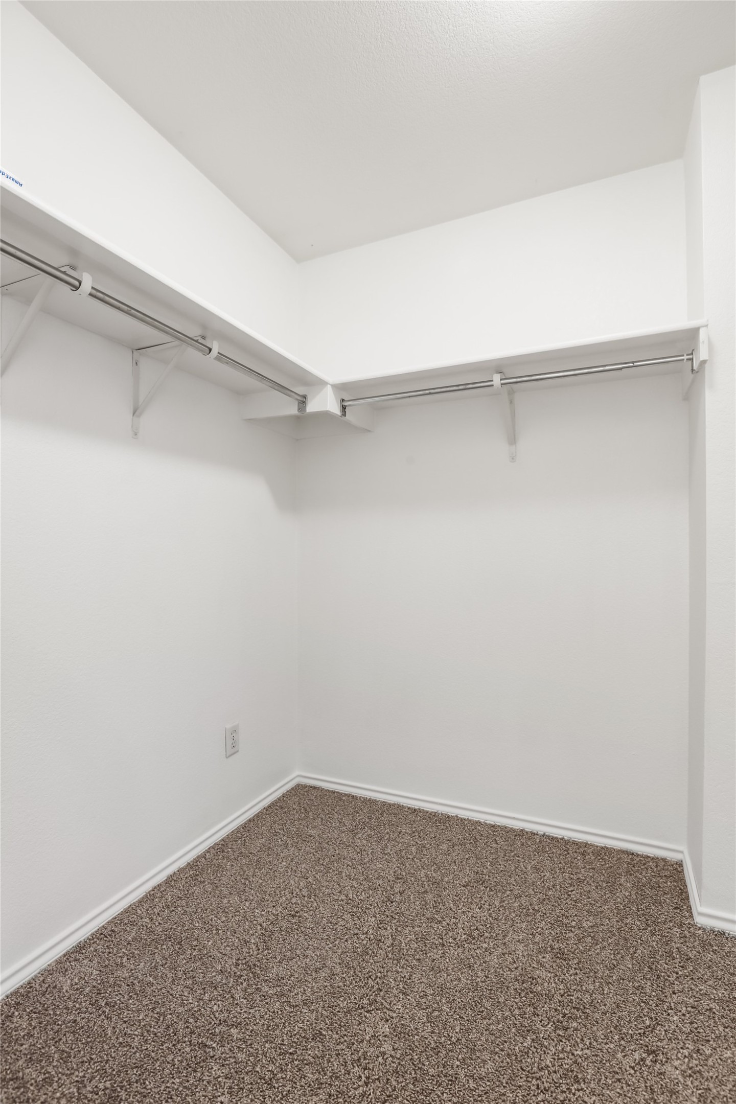 2010 Ashberry Trail Georgetown, TX 78626 - Photo 15 of 24 Walk in closet featuring dark carpet