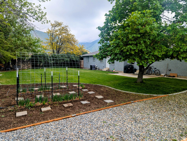 897 East 1200 North Mapleton, UT 84664 - Photo 23 of 54 Fenced backyard featuring a vegetable garden and a mountain view