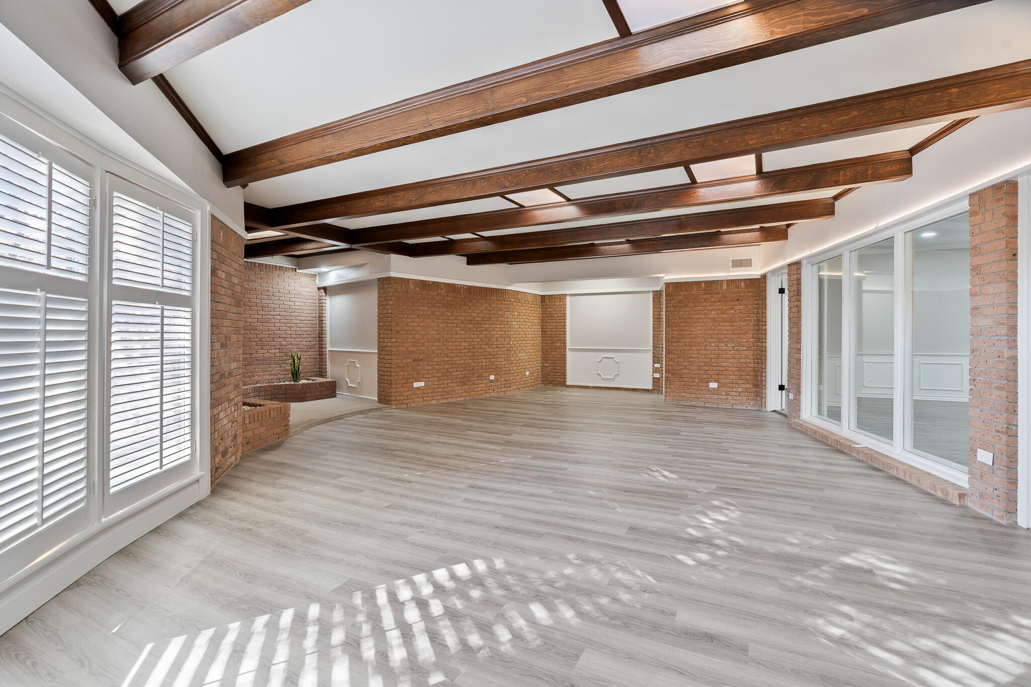 207 Yucca Terrace Plainview, TX 79072 - Photo 19 of 50 a view of a room with wooden floor