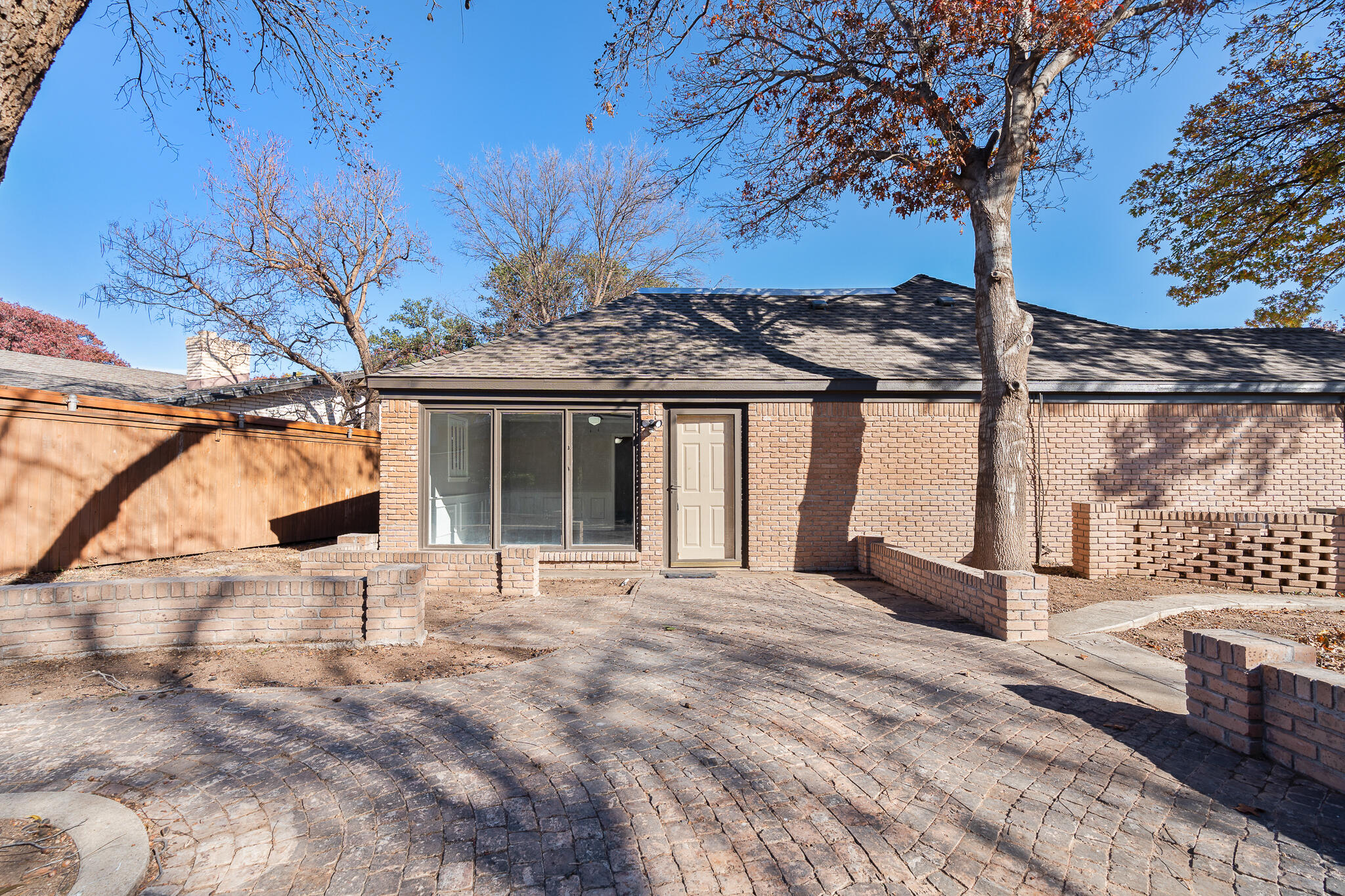 207 Yucca Terrace Plainview, TX 79072 - Photo 39 of 50 a view of a house with a wooden fence