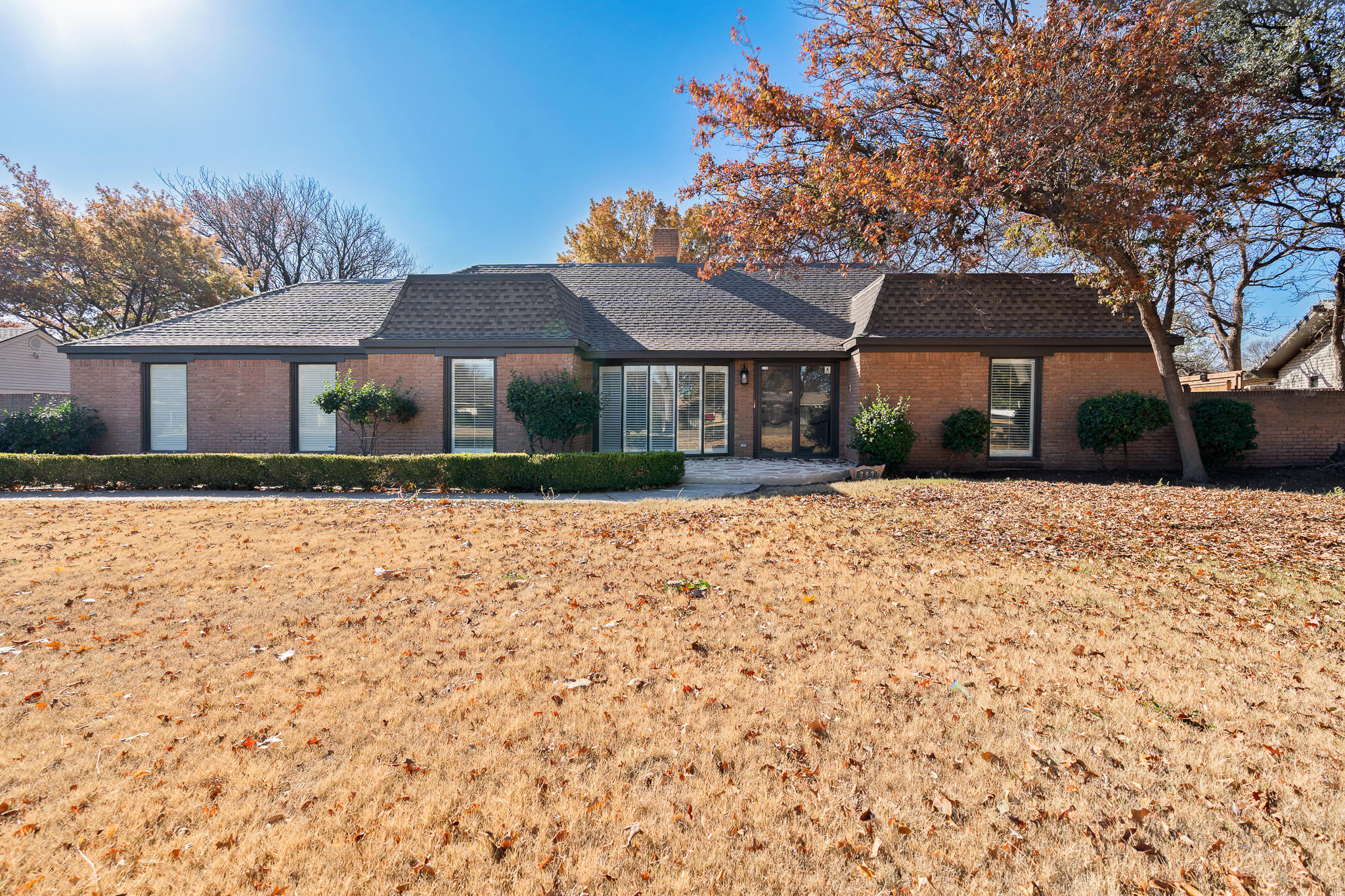 207 Yucca Terrace Plainview, TX 79072 - Photo 47 of 50 a front view of a house with a yard