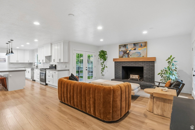 4150 Dover Lane Provo, UT 84604 - Photo 14 of 44 Spacious open-concept interior featuring light wood-finish flooring throughout