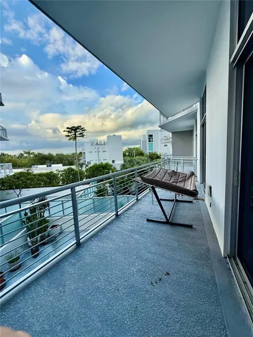 a view of roof deck with furniture