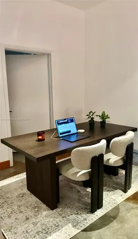 a view of a workspace with furniture