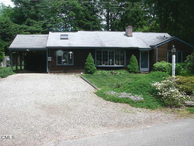 28 Woods Grove Road Westport, CT 06880 - Photo 1 of 1 front view of a house with a yard