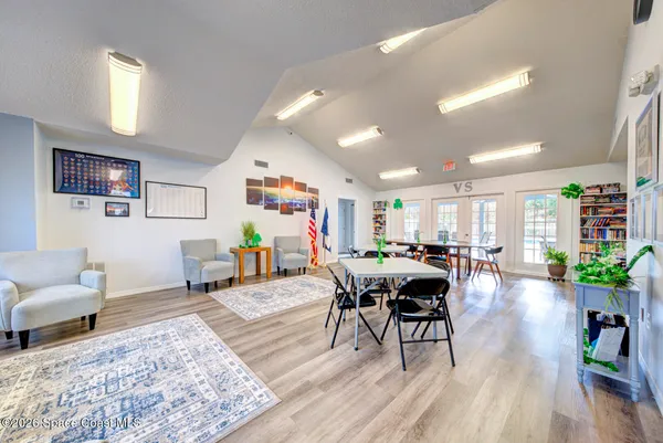 a view of a dining room with furniture window and wooden floor