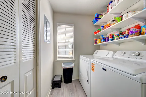 a utility room with dryer and washer