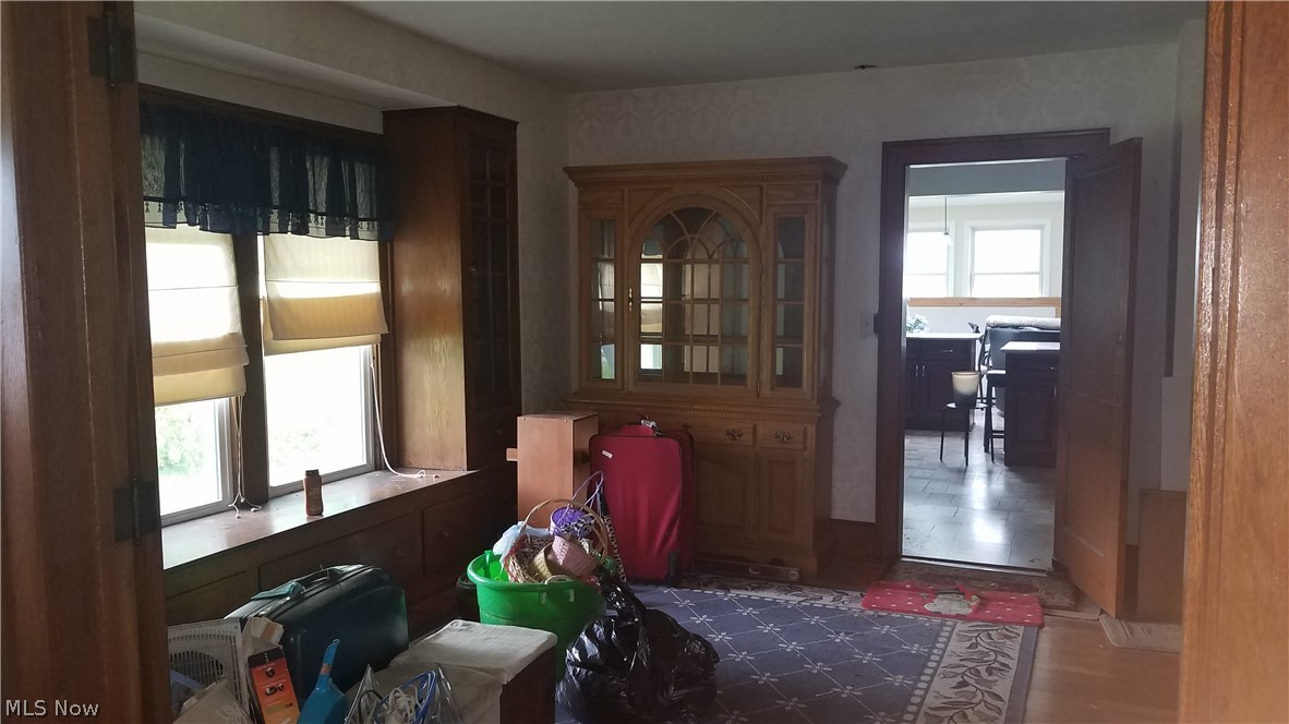 27375 Pettibone Road Solon, OH 44139 - Photo 5 of 11 Formal dining room with hardwood, built-in window seat and glass cabinets flanking the large windows.