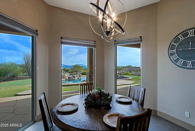a view of a lake with couches chairs