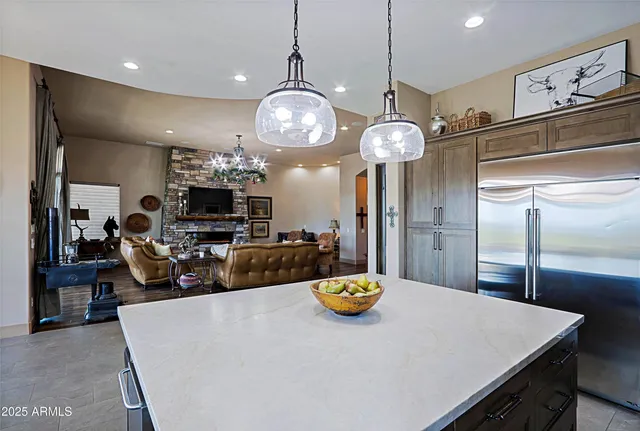 a view of a dining room with furniture wooden floor and chandelier