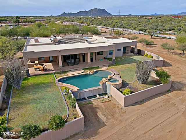 a view of a lake with couches and city view
