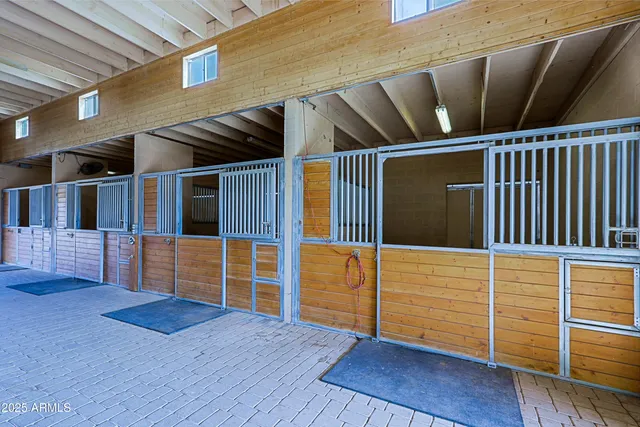 a bathroom with a granite countertop sink and a mirror with toilet