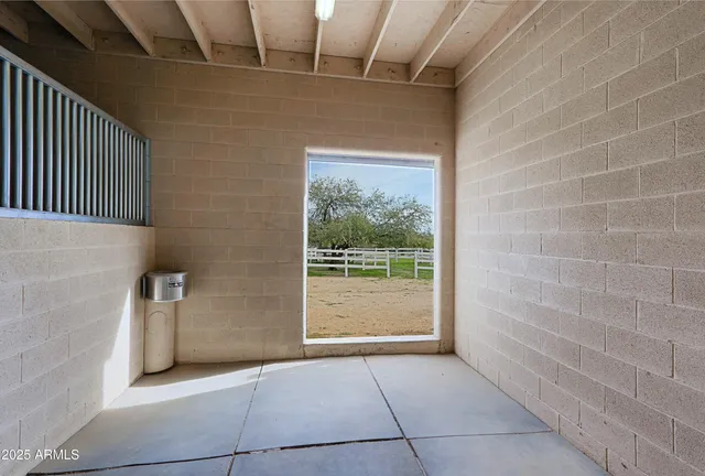 a view of a dining room with furniture and a kitchen
