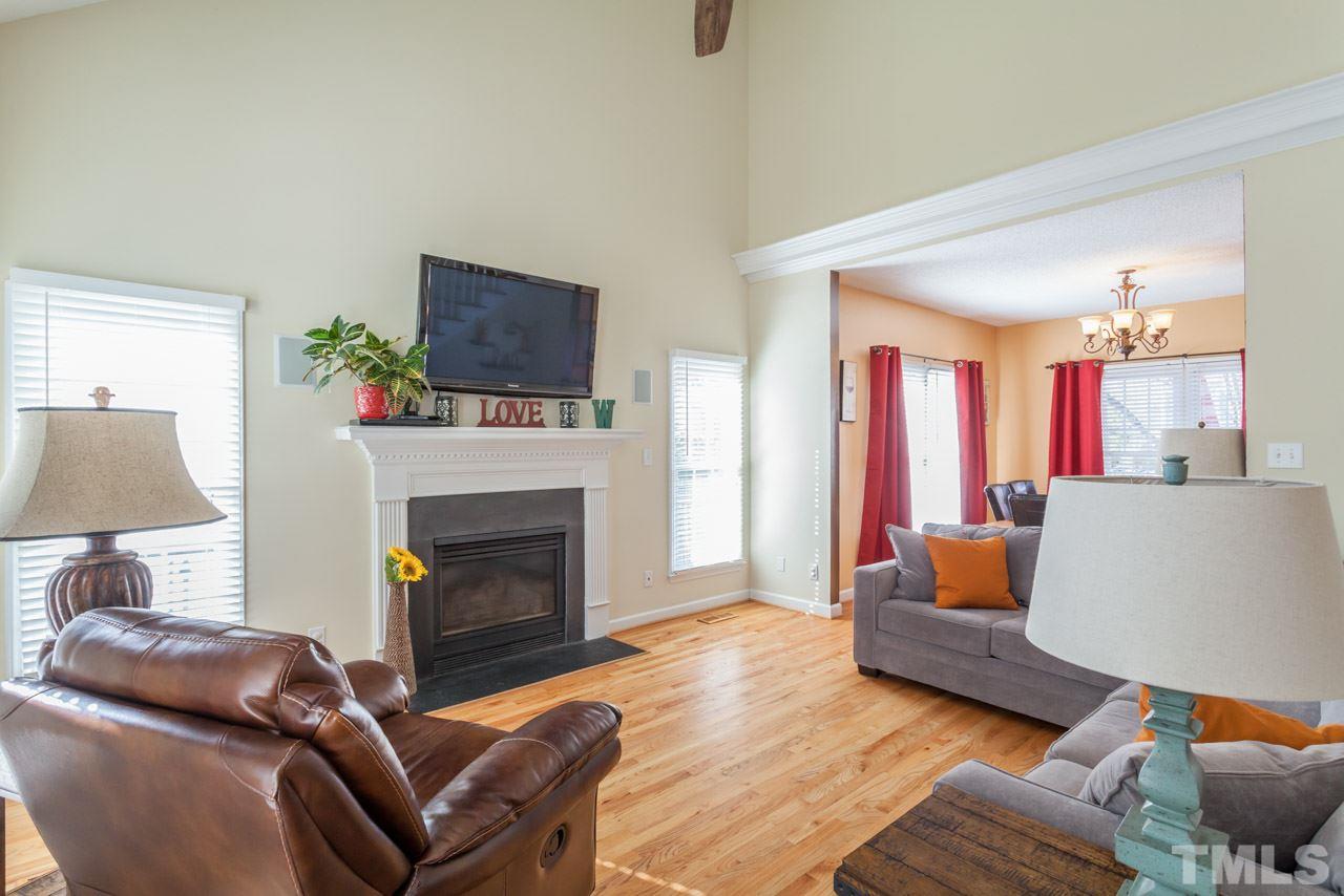 4601 Atterbury Court Raleigh, NC 27604 - Photo 2 of 25 a living room with furniture and a fireplace
