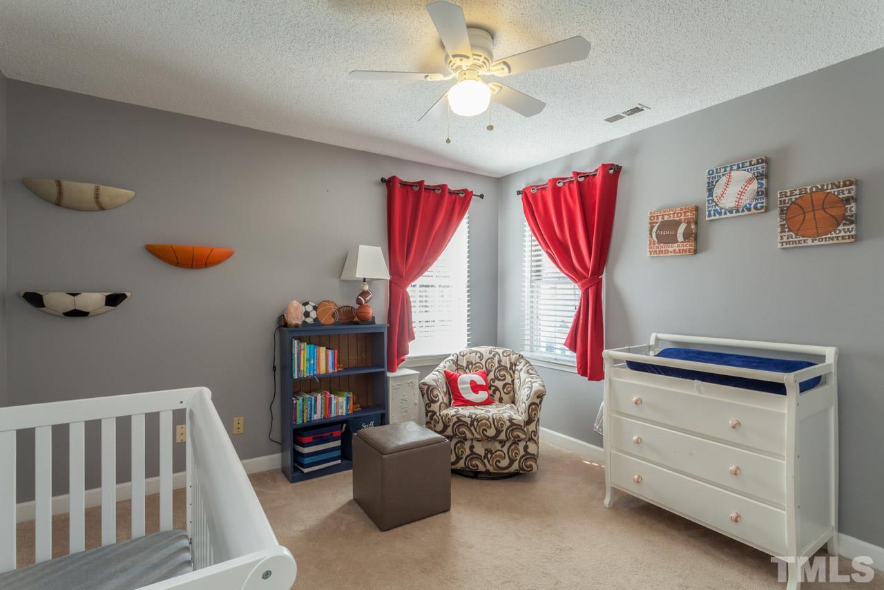 4601 Atterbury Court Raleigh, NC 27604 - Photo 16 of 25 a living room with furniture and a window