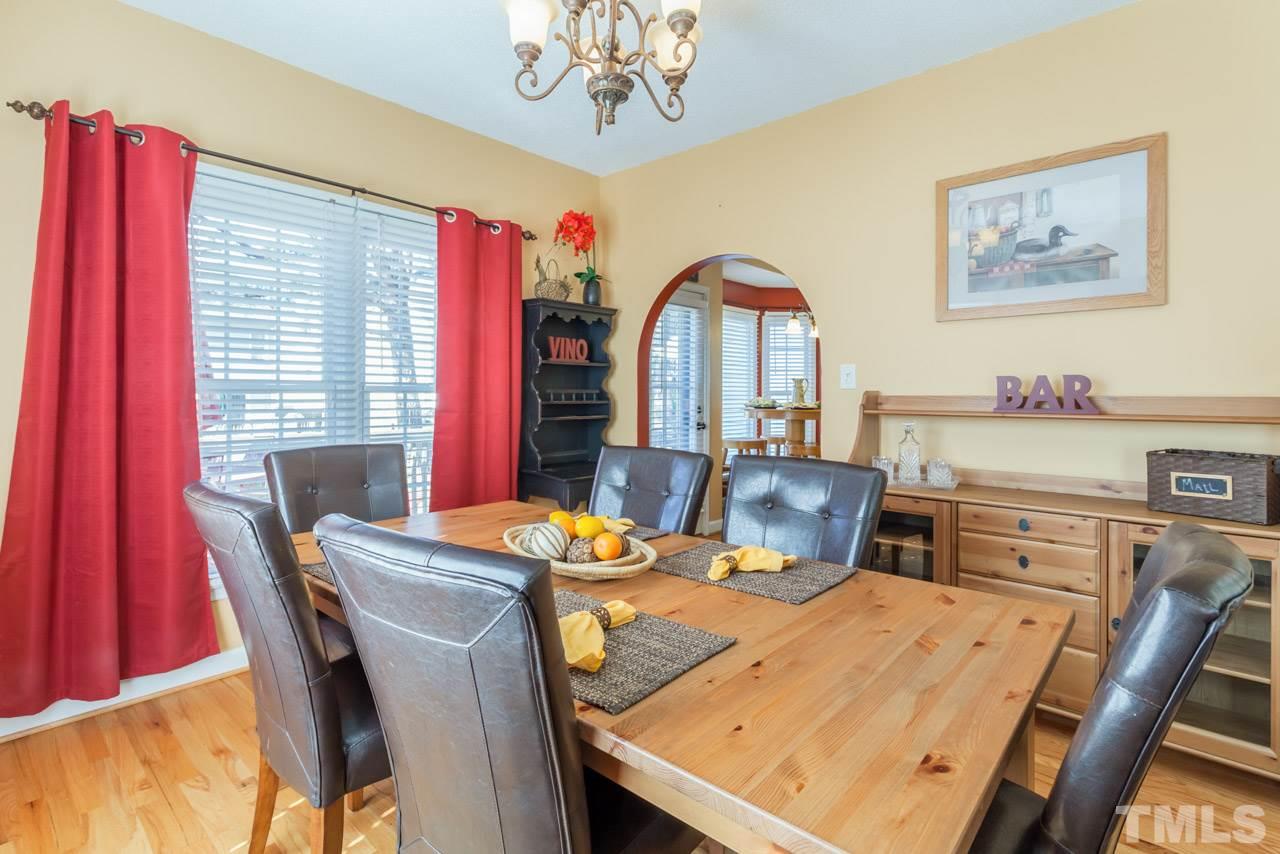4601 Atterbury Court Raleigh, NC 27604 - Photo 10 of 25 a view of a dining room with furniture window and outside view