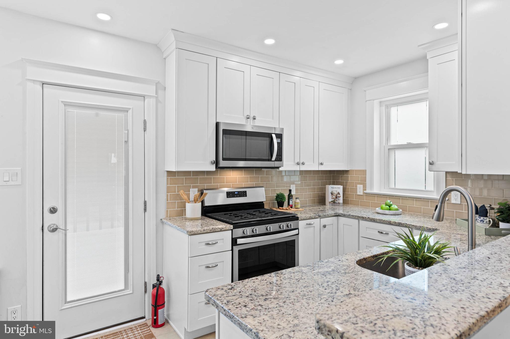 32 Chatham Road Ardmore, PA 19003 - Photo 11 of 23 a kitchen with a sink stove and refrigerator