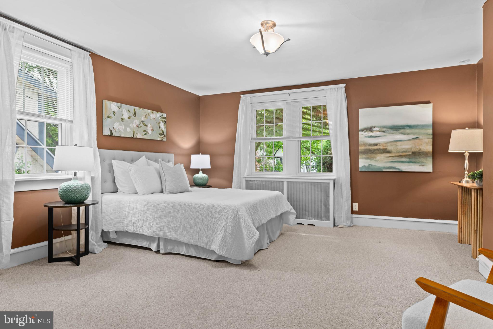 32 Chatham Road Ardmore, PA 19003 - Photo 14 of 23 a spacious bedroom with a bed and glass window