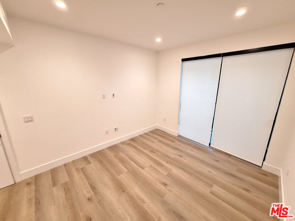 8326 Blackburn Avenue, Unit 204 Los Angeles, CA 90048 - Photo 11 of 17 a view of room with wooden floor