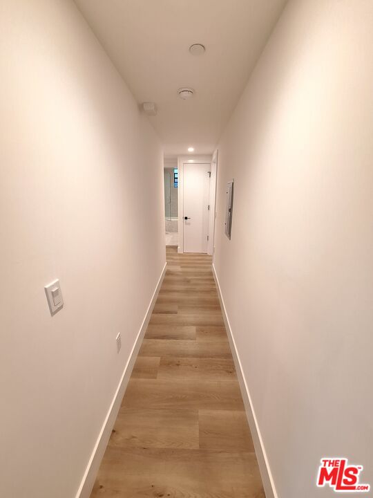 8326 Blackburn Avenue, Unit 204 Los Angeles, CA 90048 - Photo 5 of 17 a view of a hallway with wooden floor and entryway