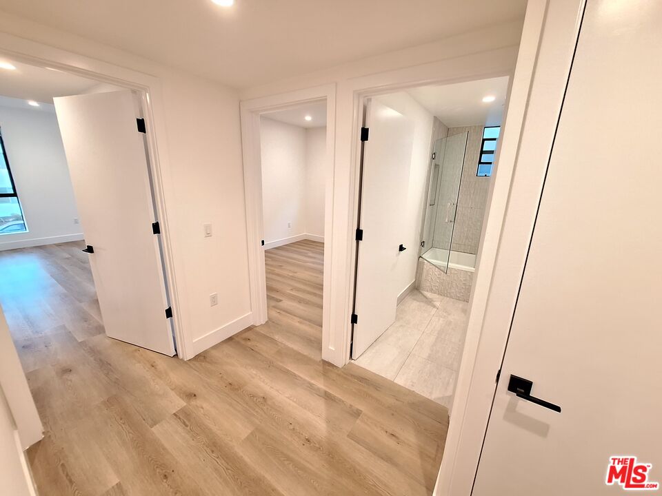 8326 Blackburn Avenue, Unit 204 Los Angeles, CA 90048 - Photo 7 of 17 a view of a hallway with wooden floor and entryway