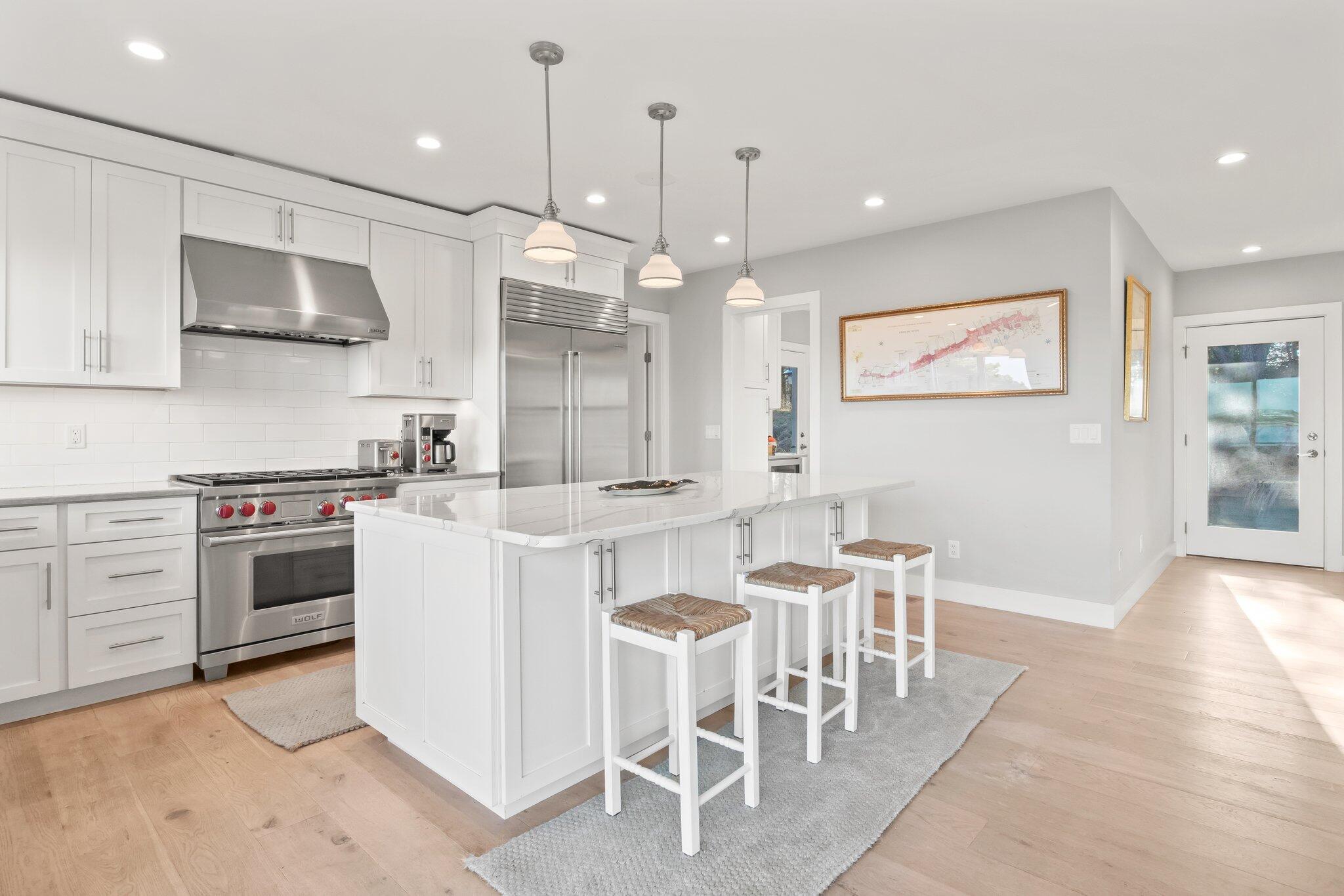 20 4th Avenue Wellfleet, MA 02667 - Photo 13 of 68 a kitchen with a table and chairs in it