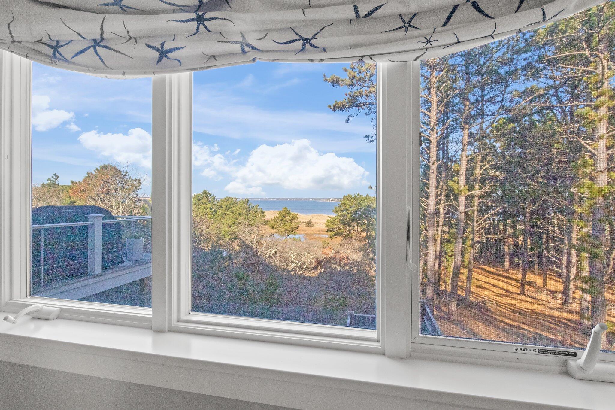 20 4th Avenue Wellfleet, MA 02667 - Photo 20 of 68 a view of a glass door and a window