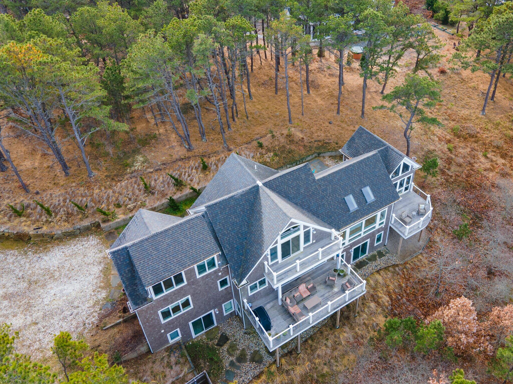 20 4th Avenue Wellfleet, MA 02667 - Photo 2 of 68 an aerial view of a house with a yard and trees