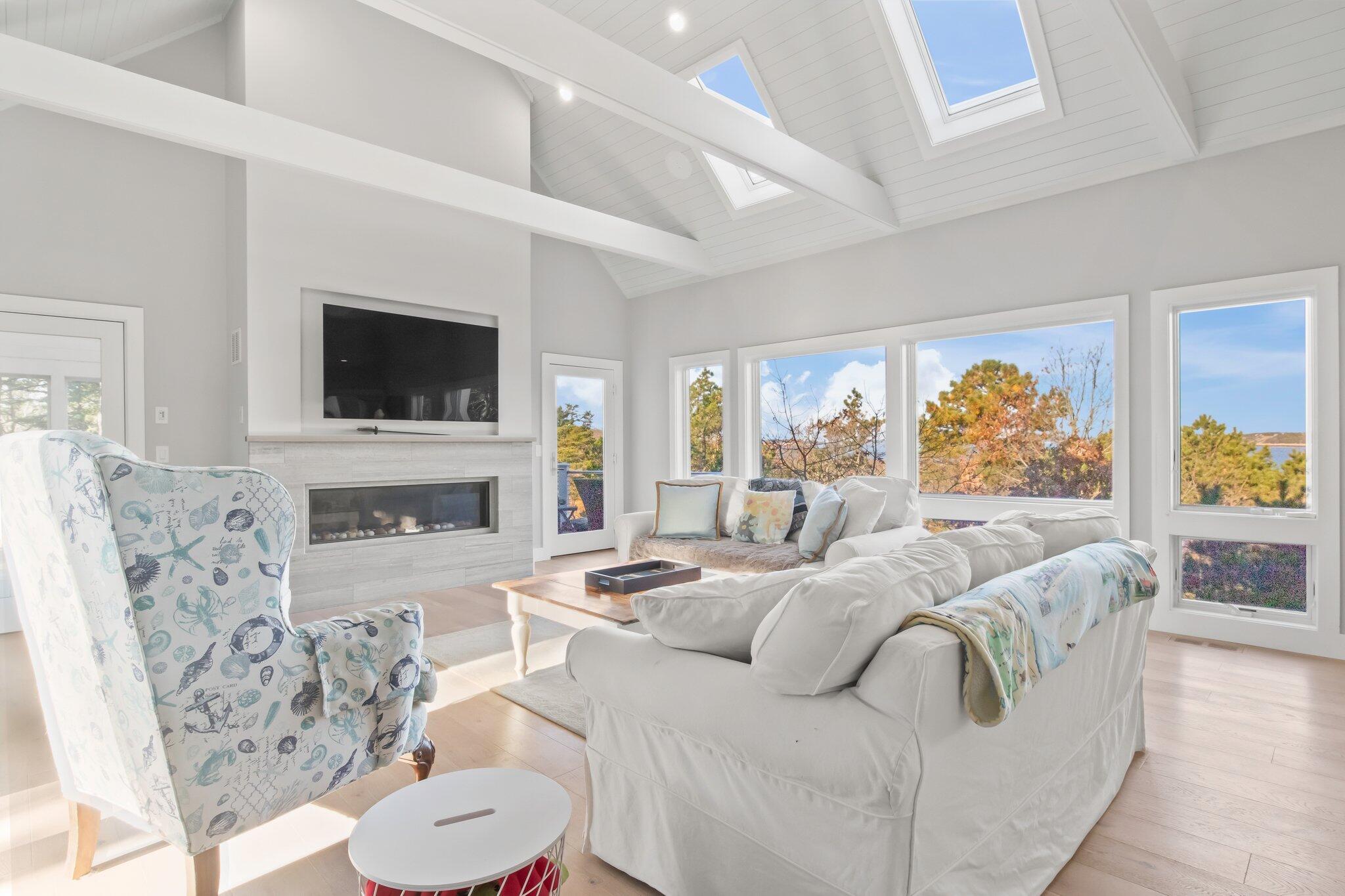 20 4th Avenue Wellfleet, MA 02667 - Photo 24 of 68 a living room with fireplace furniture and a flat screen tv