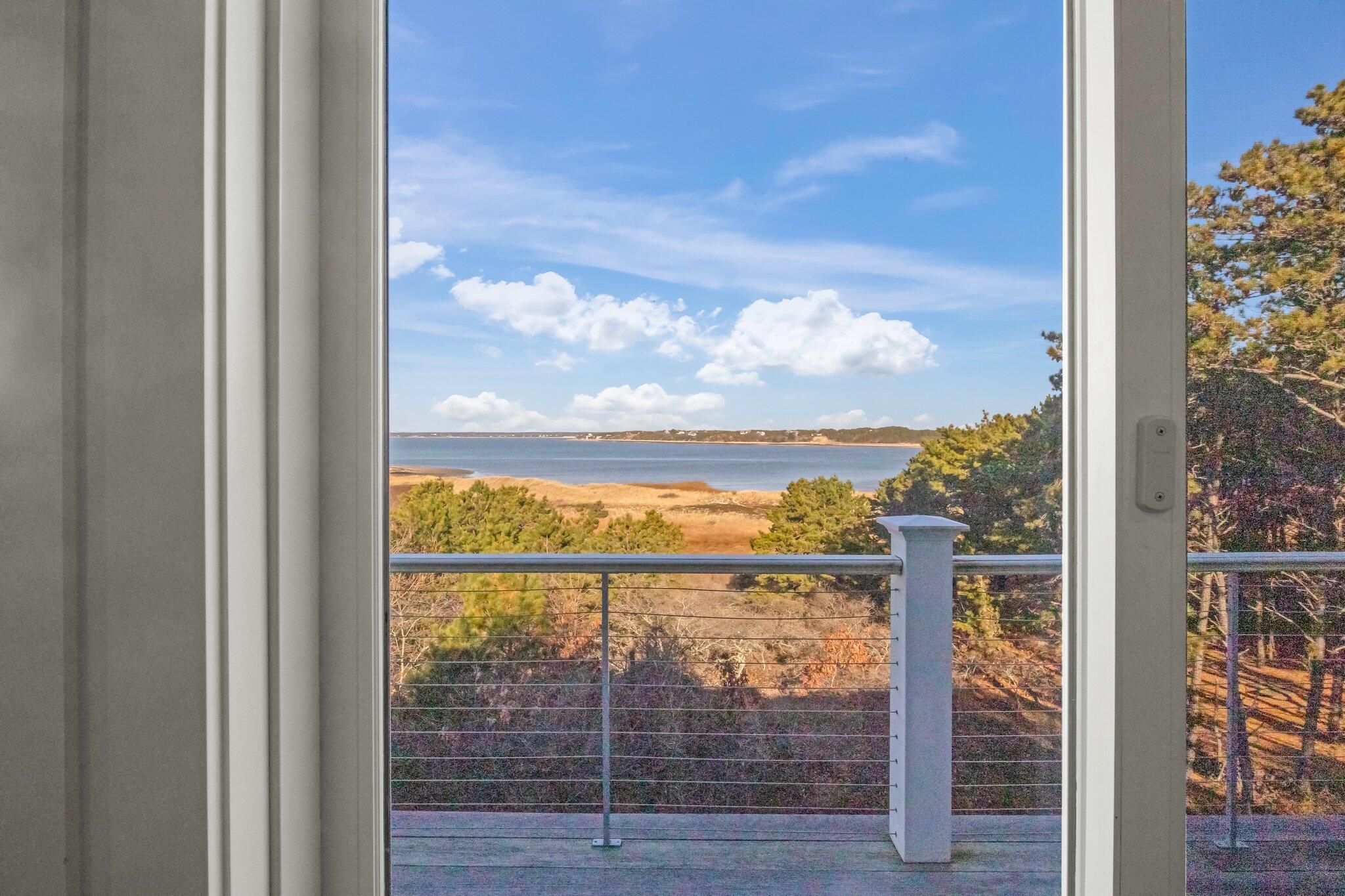 20 4th Avenue Wellfleet, MA 02667 - Photo 31 of 68 a view of a glass door with a view of sky from balcony